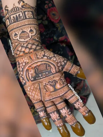 A heavy Indian design packed with motifs. This single-hand design includes an elephant, swan, lotus, palace, and peacock, showcasing a variety of elements.