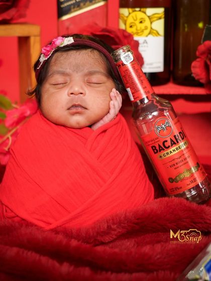 Another variation with a "Bacardi" bottle prop. I work with parents to create themes that match their personalities and sense of humor.