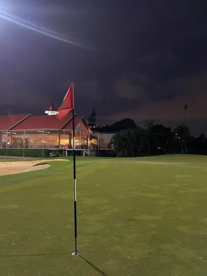 The clubhouse at Bangalore Golf Club lit up at night. The facilities provide a perfect place to relax and discuss the day's round after our session.