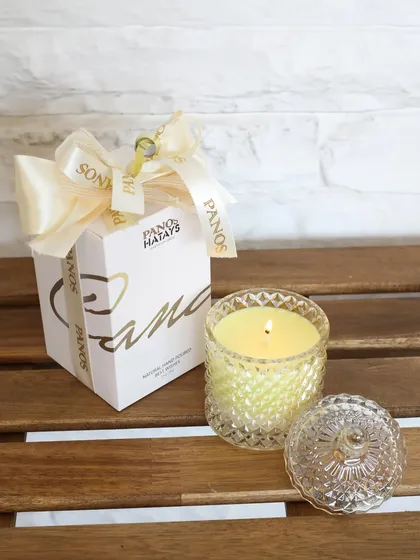 Our amber Crystal Cove candle, presented with its signature Panos gift box. This piece is a perfect gift, offering a moment of calm and a beautiful keepsake.
