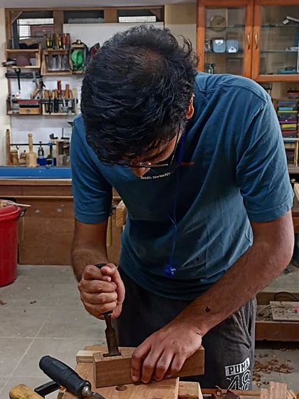 Nihal cleaning up the walls of a mortise with a sharp chisel. This is where the final precision work happens.
