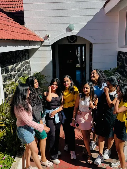 A candid moment of conversation and smiles outside our Kodaikanal accommodation.