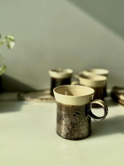 A collection of our metallic mugs and plates. They are perfect for gifting or for elevating your own coffee or tea experience.