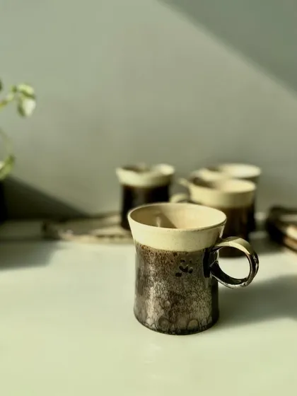 A collection of our metallic mugs and plates. They are perfect for gifting or for elevating your own coffee or tea experience.