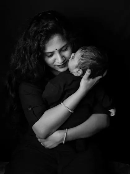 There is a special kind of quiet in moments like these. This black and white portrait captures the pure, unconditional love in a mother's gentle kiss. My goal is always to create timeless images that let the emotion speak for itself.