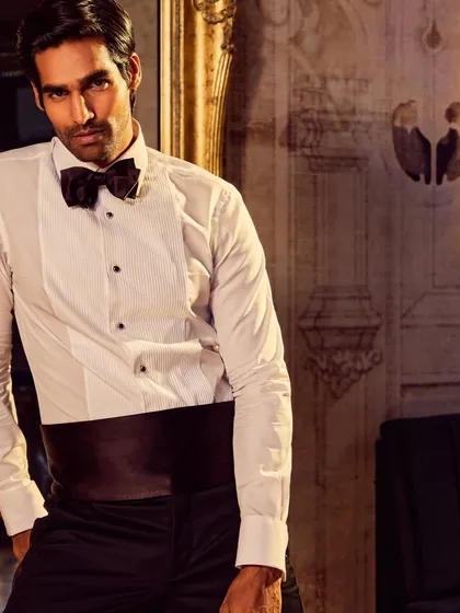 A full-body shot showcasing a complete tuxedo look. This type of image is essential for fashion lookbooks, giving customers a clear view of the garment's fit and style.