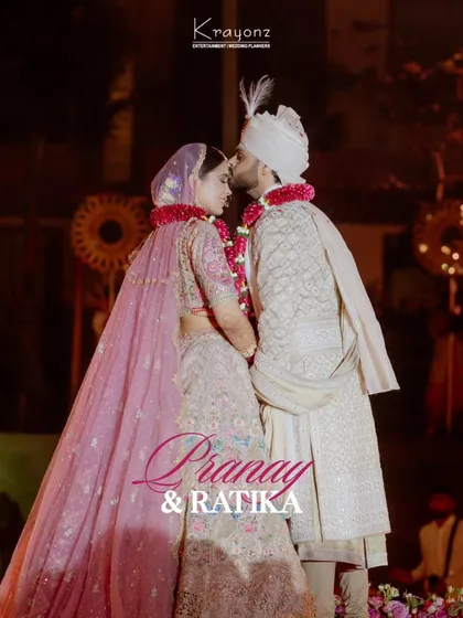 A tender kiss on the forehead, a gesture of love and protection. This intimate moment between the bride and groom is a beautiful memory from their special day.