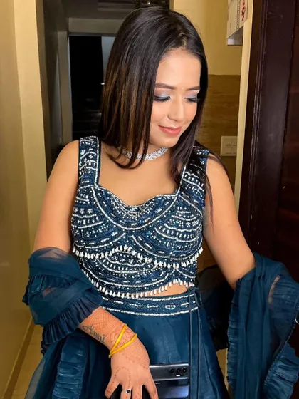 Another look at the details of this popular dark blue rental lehenga. The pearl and sequin work on the blouse is exquisite.