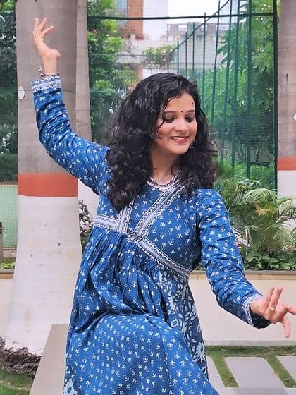 Another look at a graceful semi-classical pose, with a focus on hand mudras and posture.