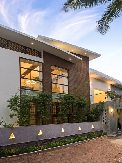 The facade of the Eco Terre residence demonstrates our expertise in modern residential architecture and eco-friendly renovation. We combined wood cladding, large glass panels, and clean lines to create a visually striking exterior that respects its natural surroundings.