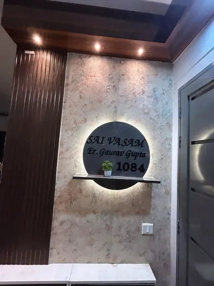 A close-up of the backlit nameplate, which adds a soft glow and a personalized touch to the home's entrance.
