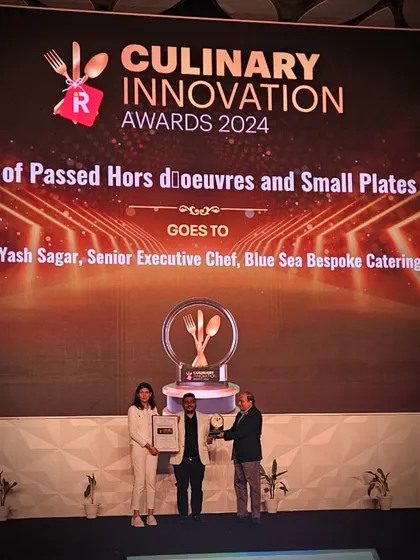 Our Senior Executive Chef, Yash Sagar, receiving the Culinary Innovation Award for "Menu of Passed Hors d'oeuvres and Small Plates." This recognizes his creativity in crafting innovative appetisers.
