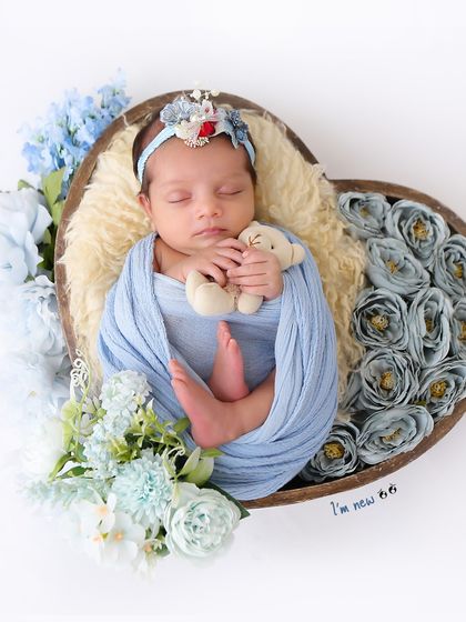 A sweet variation where the baby is holding a tiny teddy bear. These small additions help make each themed session unique and personal.