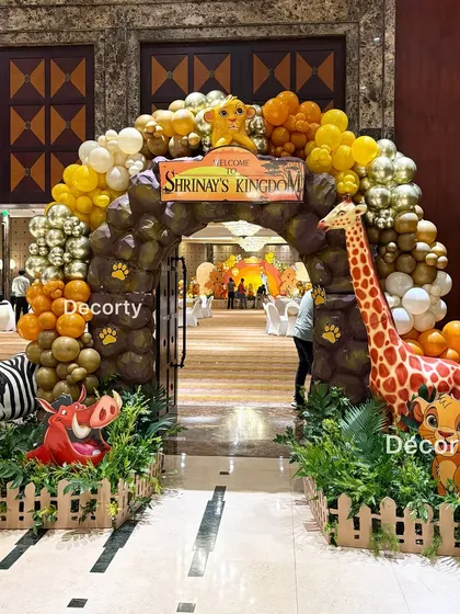 The grand entrance archway from a slightly different angle, showing the path leading into the main party area.