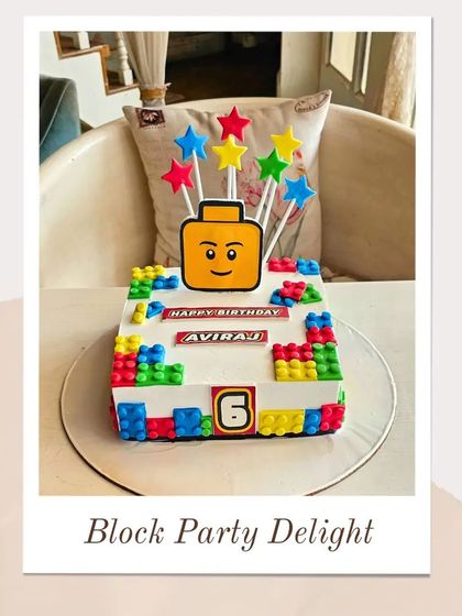 A bright and cheerful Lego-themed cake with a Lego head topper, colorful stars, and edible blocks for a 6th birthday.