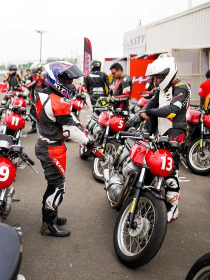 A student getting ready for his session, with a coach making final checks. This personal attention ensures every rider is prepared and confident.