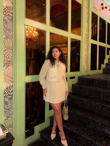 Served and ate. This is my look for a sushi dinner at a chic Delhi restaurant, showing off a sophisticated, layered outfit with a pleated skirt and vest.