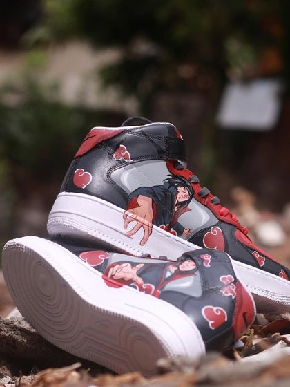 For the Naruto fans, here's a pair of Itachi-themed Nike Air Force 1 Mids. I wanted to do something a bit different, focusing on his iconic pose against the Akatsuki cloud pattern. The red, grey, and black color scheme is super clean.