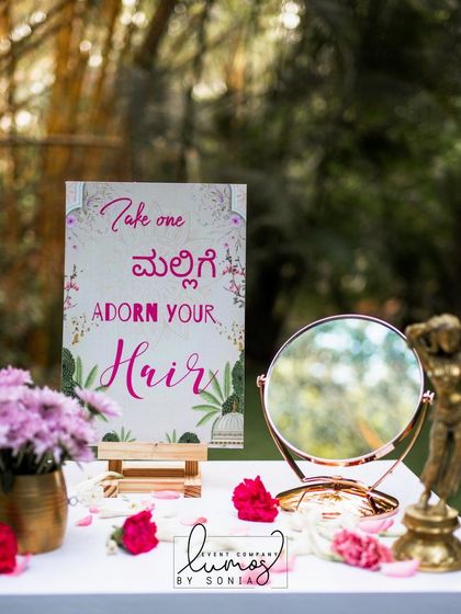 A "Mallige" (jasmine) station, inviting guests to adorn their hair with fresh, fragrant flowers, a beautiful South Indian tradition.