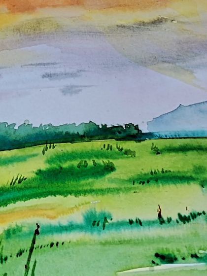 A serene landscape created with watercolors. In our classes, you can learn how to use this medium to capture the soft light and gentle colors of nature.