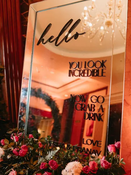 A fun, interactive mirror sign that encourages guests to enjoy the party.