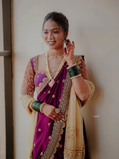 This bride's smile says it all. Her natural makeup look for the wedding ceremony features soft tones that enhance her features without feeling heavy.