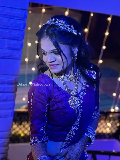 A beautiful portrait from the Bandoli ceremony. The makeup is kept glamorous with a focus on the eyes, and the hairstyle is adorned with a delicate tiara.