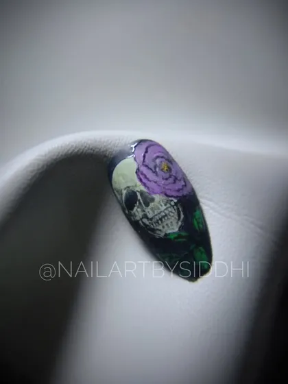 An edgy and artistic design featuring a skull with a purple rose, all hand-painted.