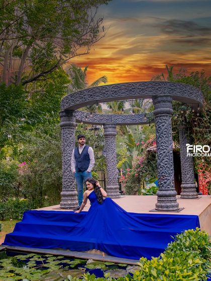 A dramatic shot at our stone gazebo set against a fiery sunset sky, creating a powerful and romantic image for a pre-wedding album.