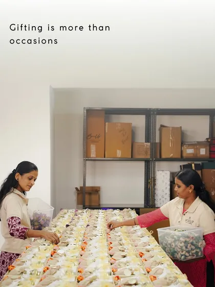 Gifting is more than occasions. Here, my team members are carefully assembling hampers, showing the dedication that goes into our work.
