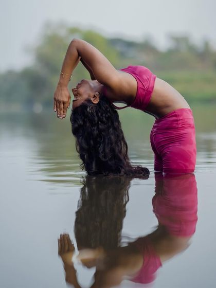 A moment of reflection and release in a water backbend. The support of the water allows for a deeper sense of letting go.