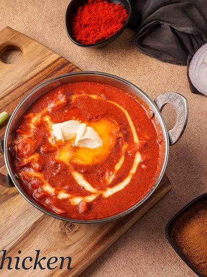 Our Butter Chicken is a crowd-pleaser, featuring tandoori chicken cooked in a mildly spiced, creamy tomato and butter sauce. It's rich, smooth, and perfect for mopping up with a fresh naan.