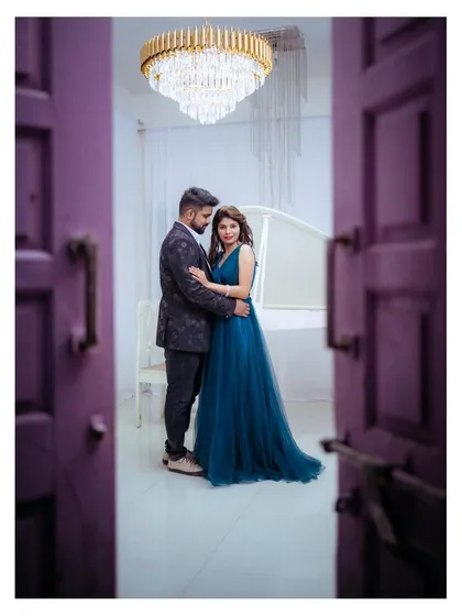 A peek through a doorway into a private, romantic moment. I often use framing techniques like this to add depth and a sense of intimacy to my couple portraits.