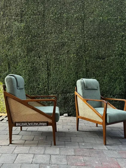 A clear shot of the lounge chairs against a green backdrop.