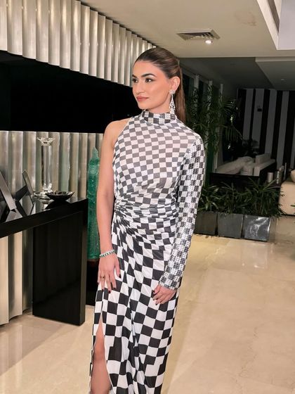 Mehr looking incredibly chic in this Amit Aggarwal dress. I kept the makeup clean and sharp with a sleek ponytail to match the modern, graphic feel of the outfit.