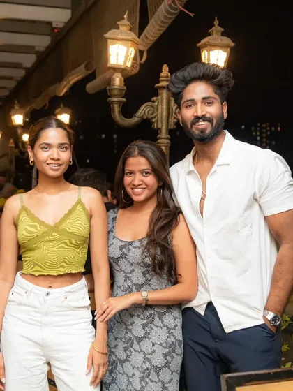 A stylish group of friends enjoying the rooftop atmosphere.