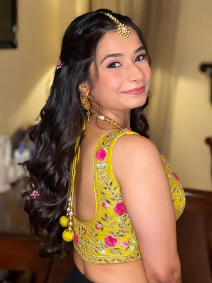 A portrait of the Haldi bride, her hairstyle fresh and pretty.