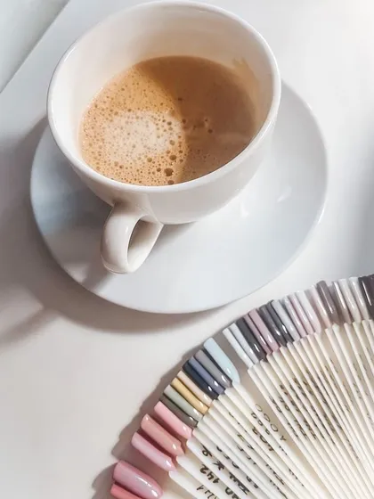 The perfect setup for a nail consultation: a coffee and our extensive color swatch wheel to help you find your perfect shade.