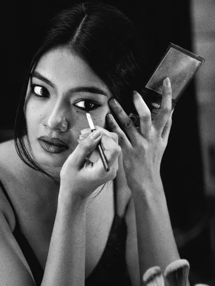 The mirror as a tool for transformation. This shot captures the intimate relationship between an actor and their reflection as they become someone else.