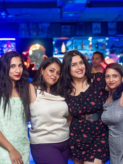 A group of ladies looking glamorous for their night out.