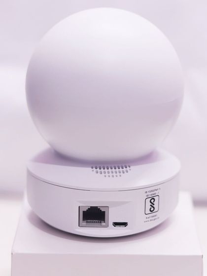 The back of the EZVIZ TY1 camera, showing the ethernet port for a wired connection and the micro USB port for power. It also supports Wi-Fi for flexible installation.