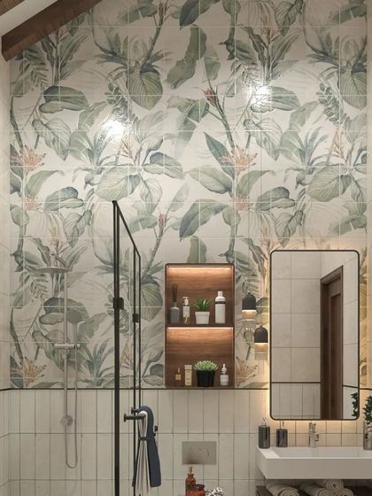 The bathroom continues the nature-inspired theme with a beautiful leafy tile pattern. We paired this with clean white tiles and modern black fixtures to create a fresh, stylish, and functional space.