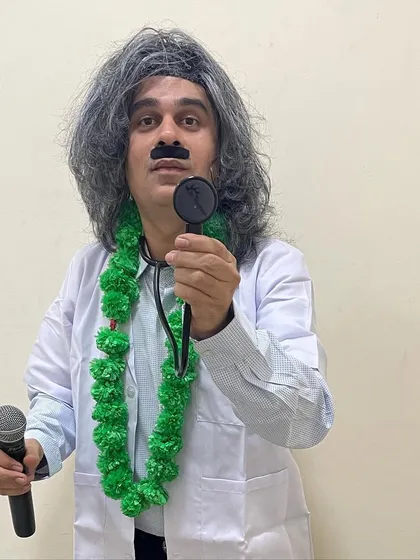 Hello ji! Sometimes I show up as a special character to surprise the guests. Here I am as the famous Dr. Mashoor Gulati, ready to diagnose a case of low energy and prescribe some fun.