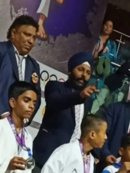 Our young student Shiva receiving his silver medal at the 2022 National Championship, a proud moment for him and the academy.