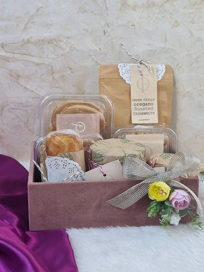 A luxurious velvet-finish box filled with our handmade snacks. This premium packaging option is perfect for high-value corporate gifting.