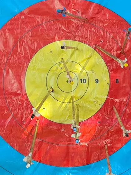 A target filled with arrows after a round at the U-13 trials. This shows the impressive consistency of our young archers.