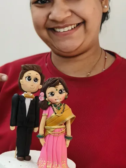 Another happy student with her beautifully crafted bride and groom topper. I make sure every class is hands-on, with personal guidance to help each student succeed.
