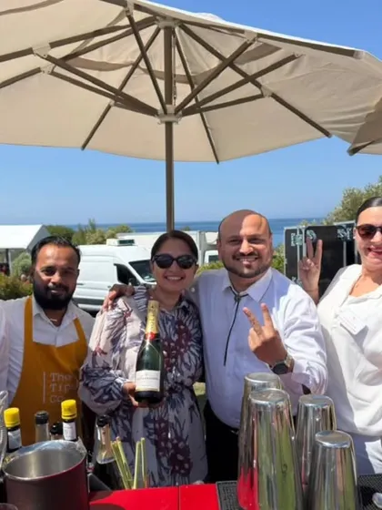 A happy moment with our clients and team at a sunny, coastal event. We pride ourselves on building great relationships and celebrating alongside our clients.