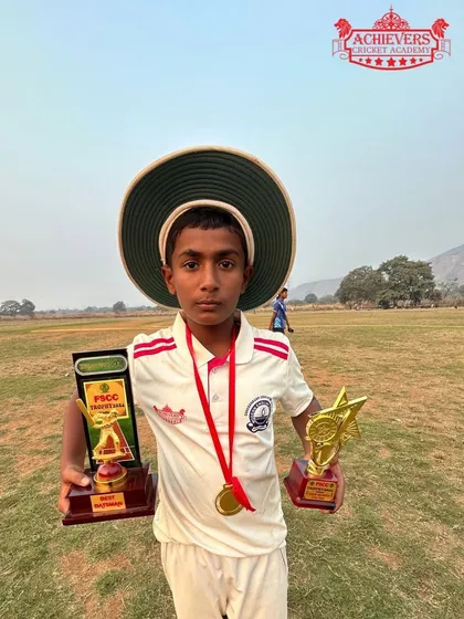 Aryan Kamble proudly displaying his 'Best Batsman' award from the Future Star U-12 Tournament.