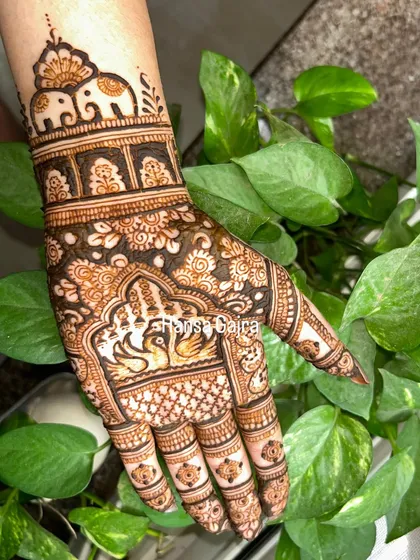 A single-hand design perfect for Karwachauth, featuring elephants, swans, and intricate floral work. It's rich in detail and traditional symbolism.